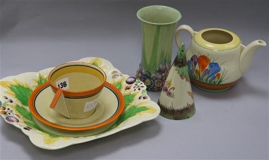 A Clarice Cliff cup and sauce, sugar sifter, vase and plater